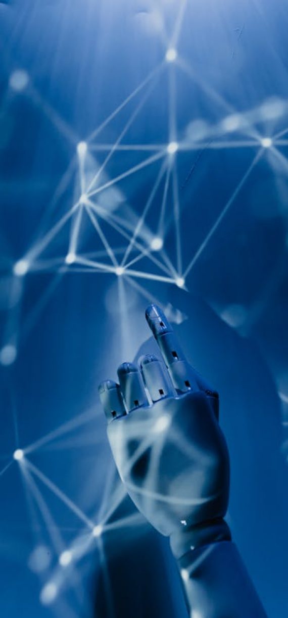 A robotic hand reaching into a digital network on a blue background, symbolizing AI technology.